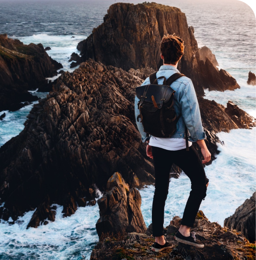 Person on Cliff Overlooking Ocean